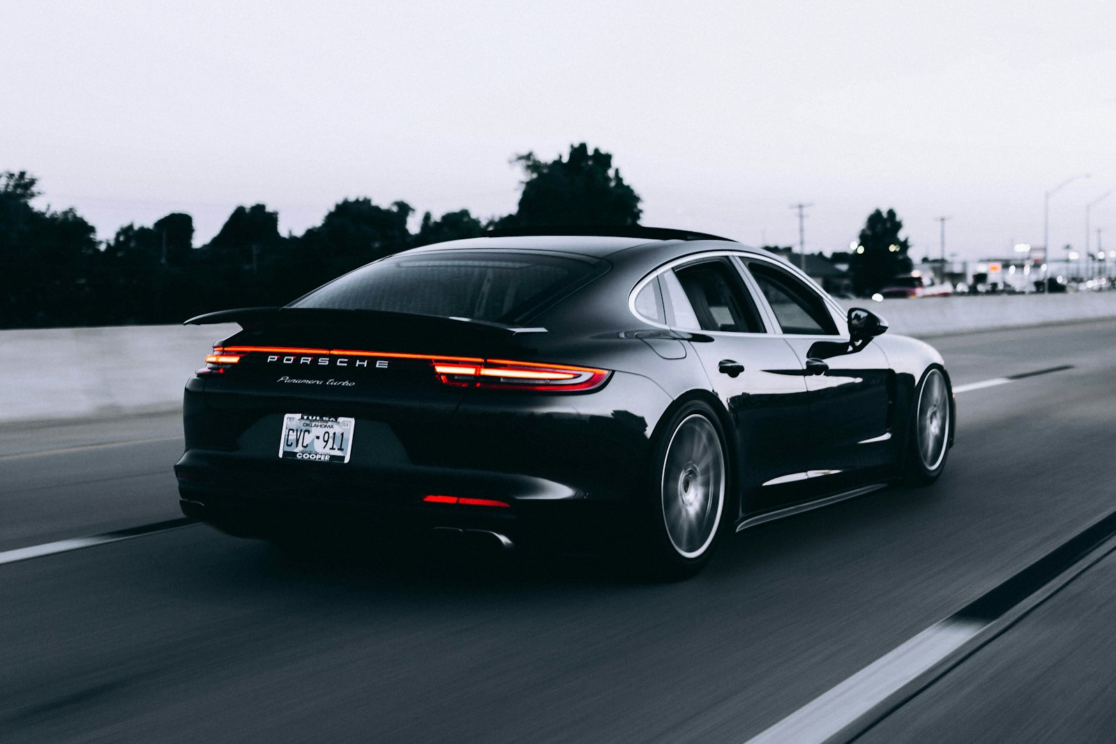 Black performance sedan on the highway after a service