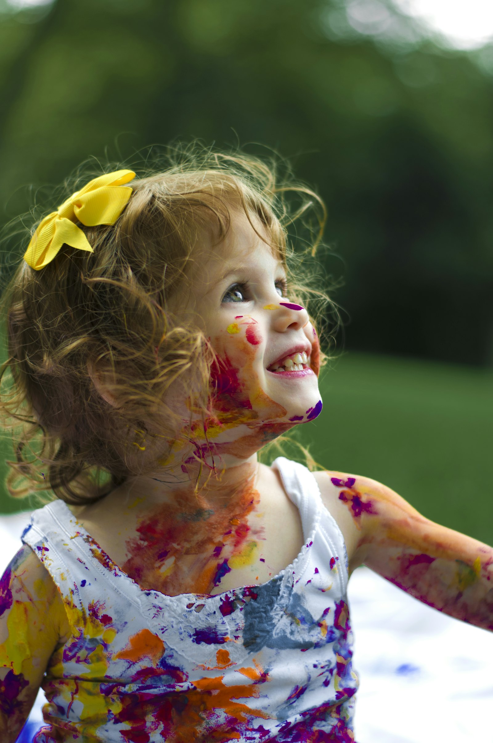 Happy young girl grinning cheerfully after her kids dentistry visit
