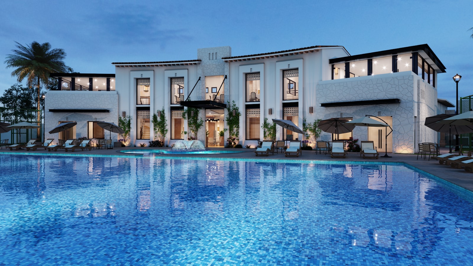 Two-storey Amaya Residence villa glowing at dusk beside its private pool